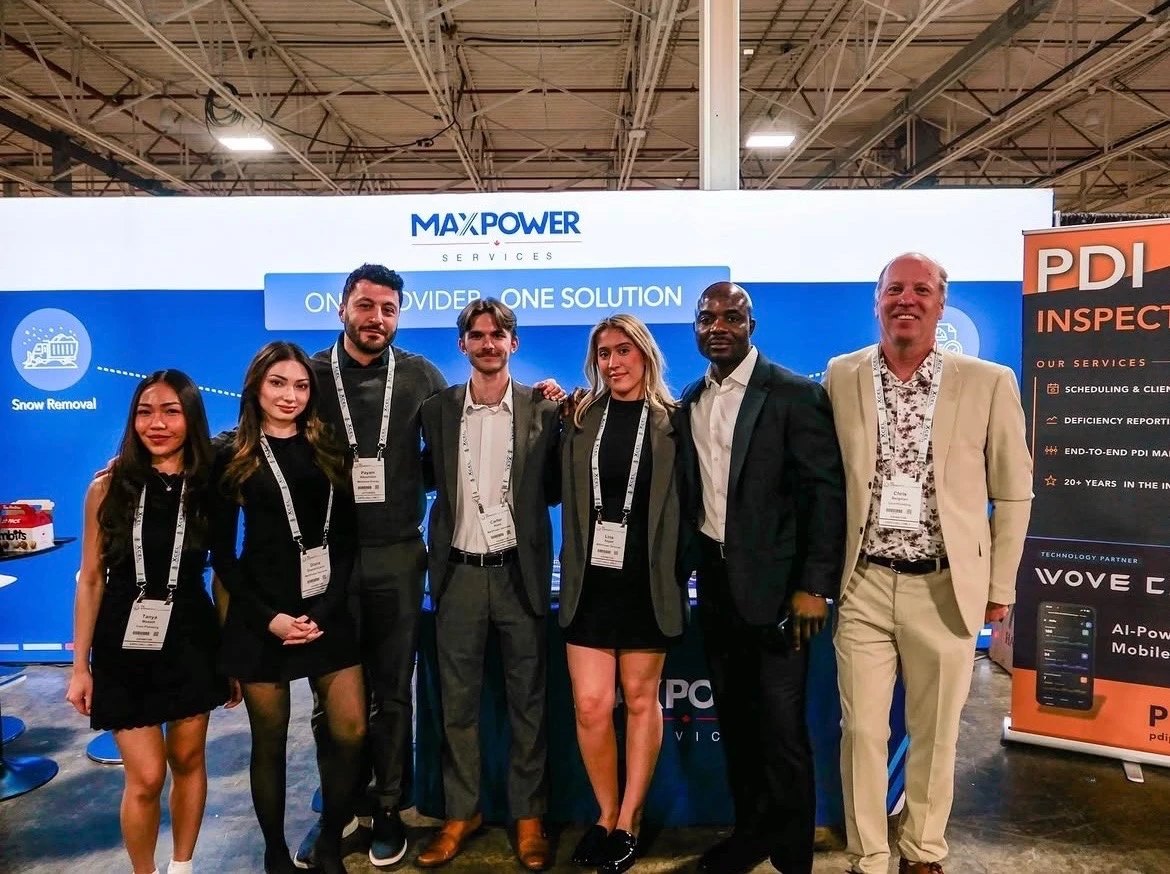 Tanya with the MAXPower Services group team at a trade-show booth
